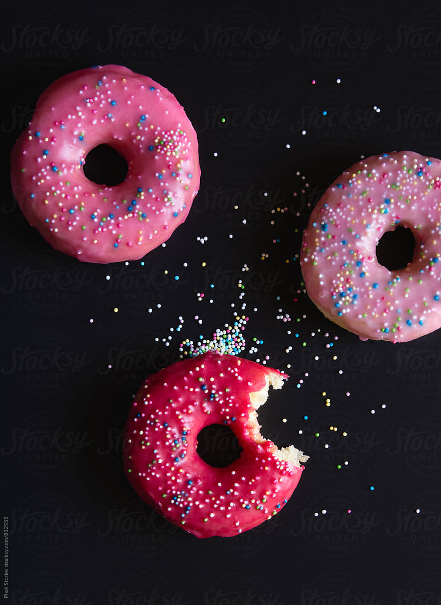 Bitten donut on dark background
