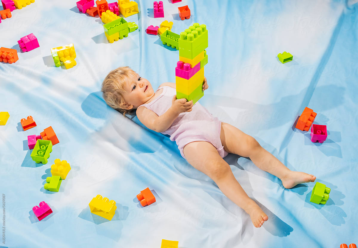Toddler holding building blocks