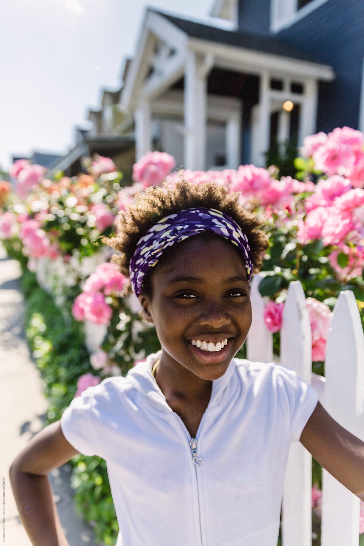 Summer Afternoon Portrait of Black Girl with Summer Roses