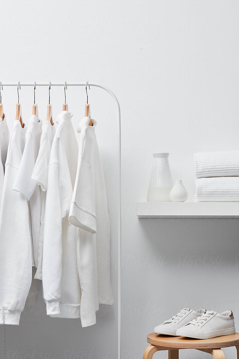 White clothes and accessories in wardrobe