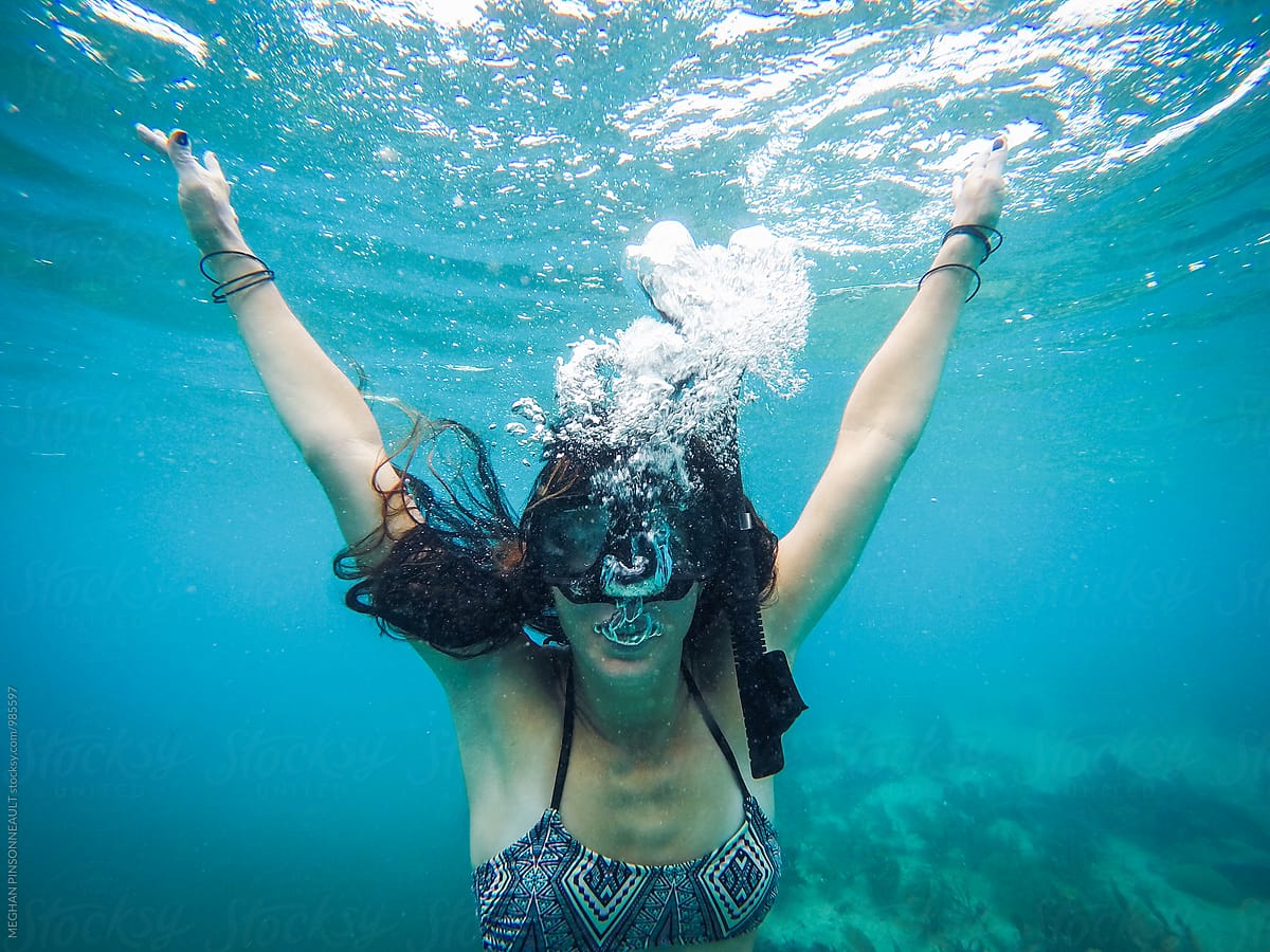 Woman Underwater in Snorkel Mask with Bubbles