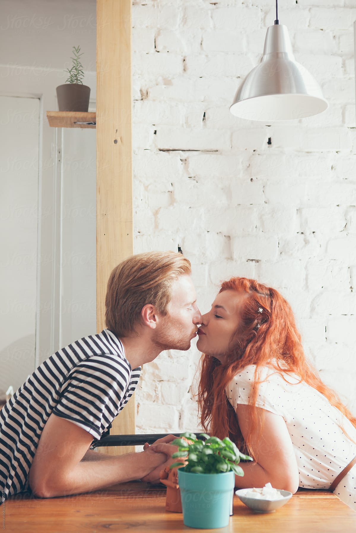Caucasian Couple Kissing At A Cafe Del Colaborador De Stocksy Lumina Stocksy 