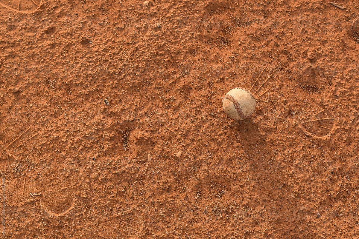 A Baseball Sits On The Ground