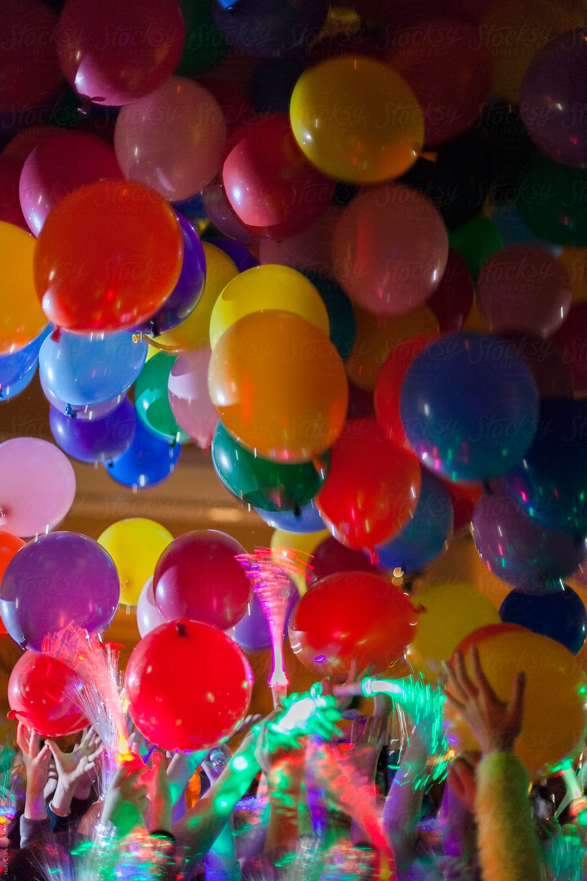 Balloons fall from the ceiling at New Year\'s Eve party for children.