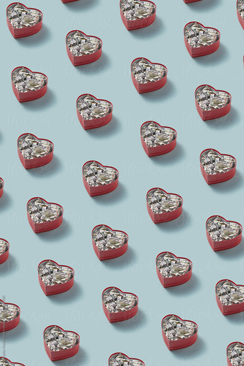 Heart-shaped boxes with dollar bills pattern.