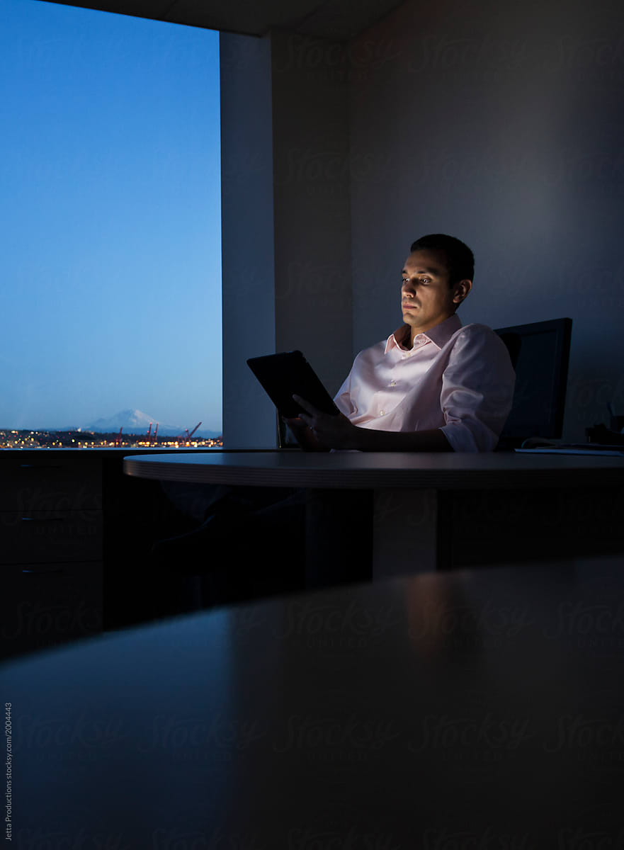 Male executive working at night