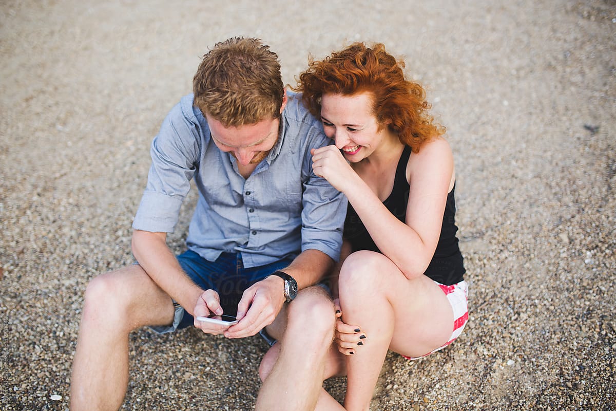 Happy Ginger Couple On The Beach By Stocksy Contributor Jovana