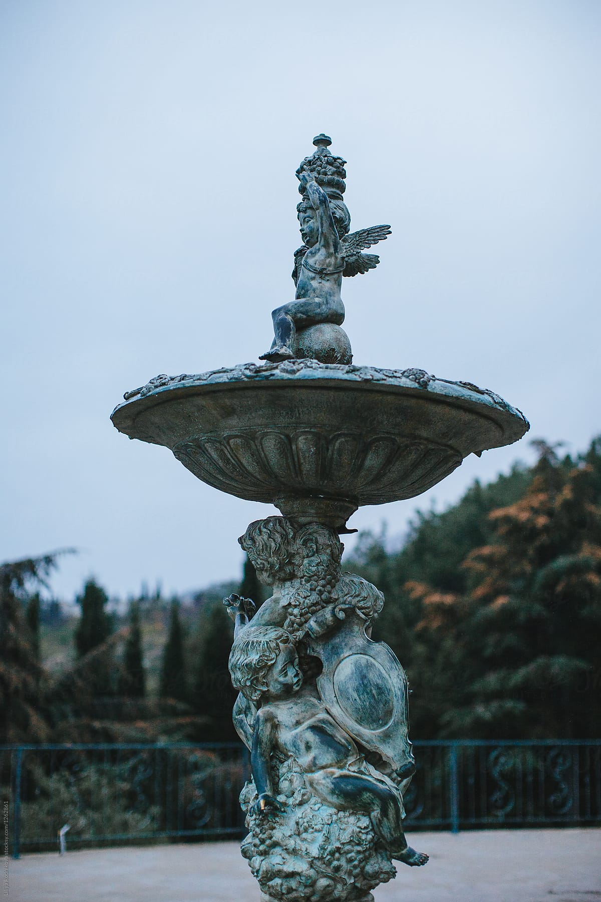 Copper fountain with cupids in the park