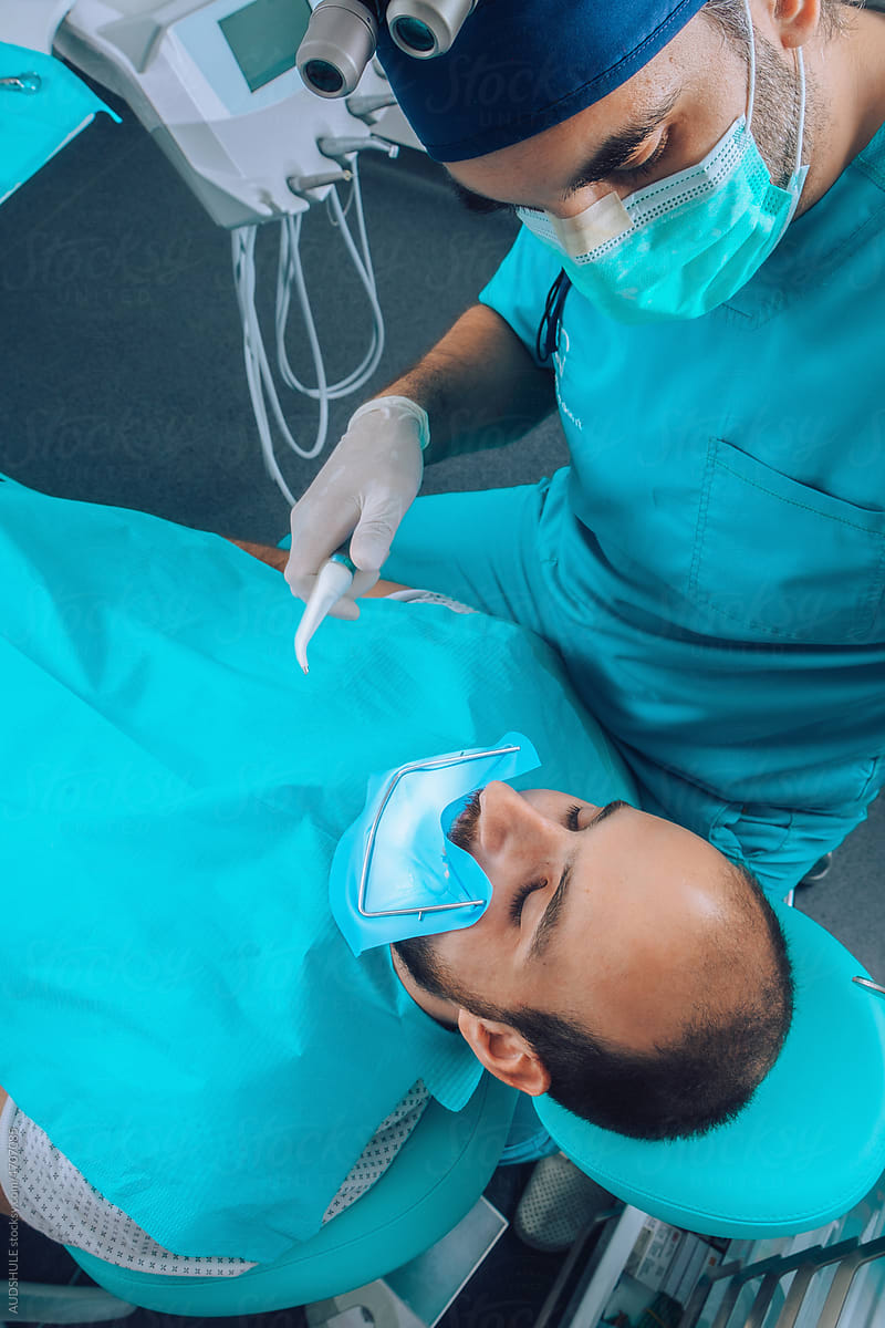Look from above on surgeon and patient  during dental  operations