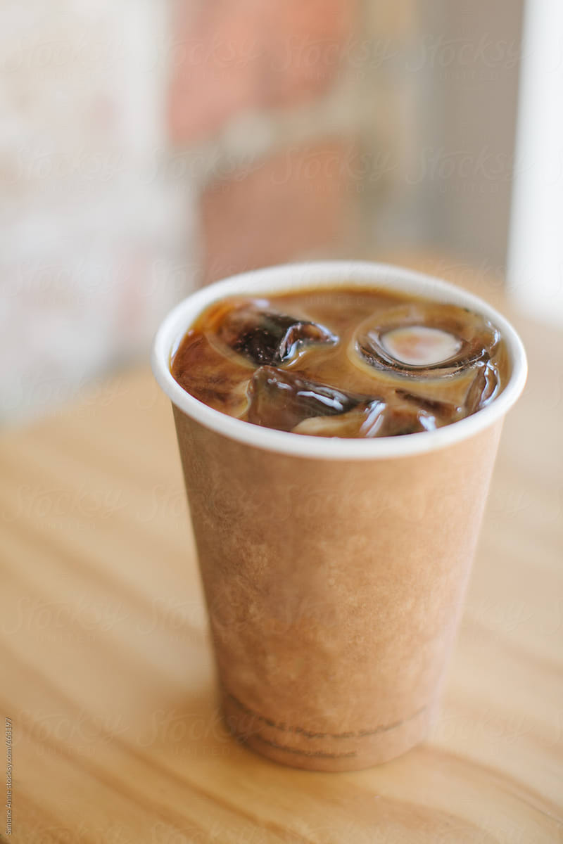Iced Coffee In A Brown To Go Cup by Stocksy Contributor Simone Anne -  Stocksy