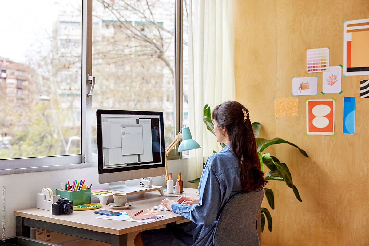 Female designer using software on computer