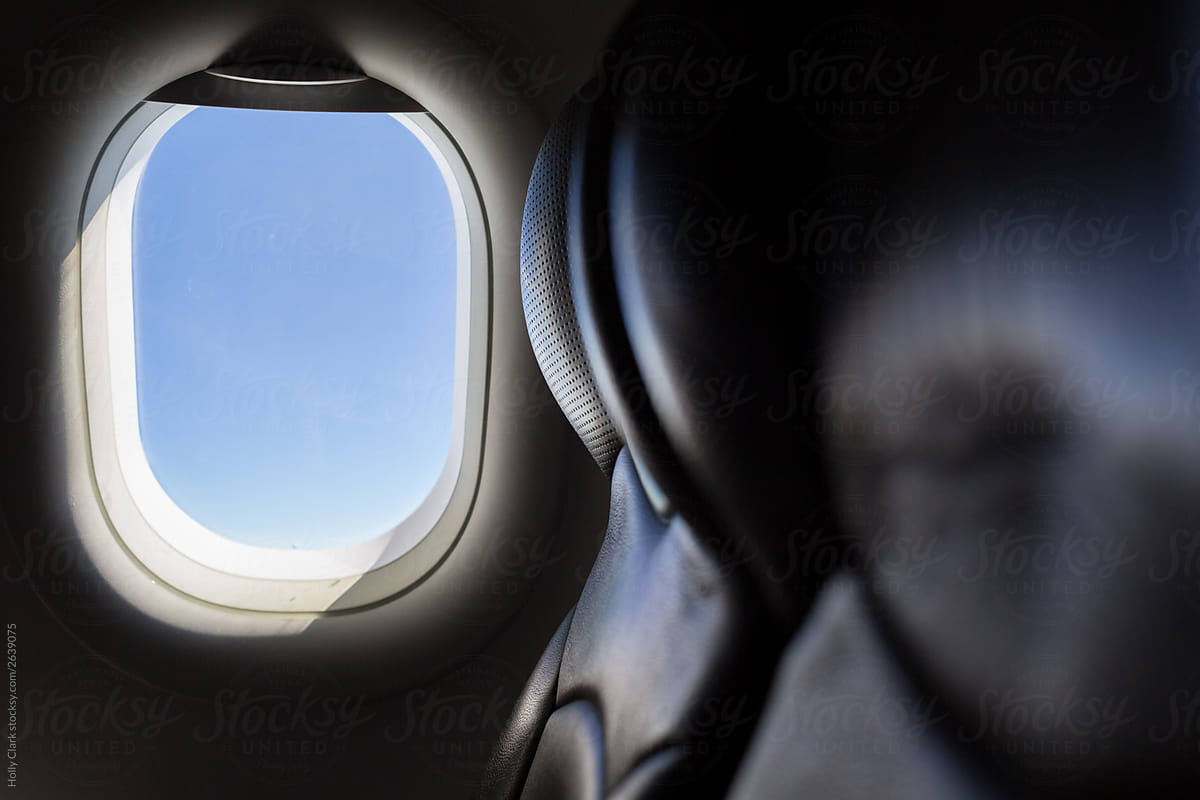 Airplane Window next to empty seats