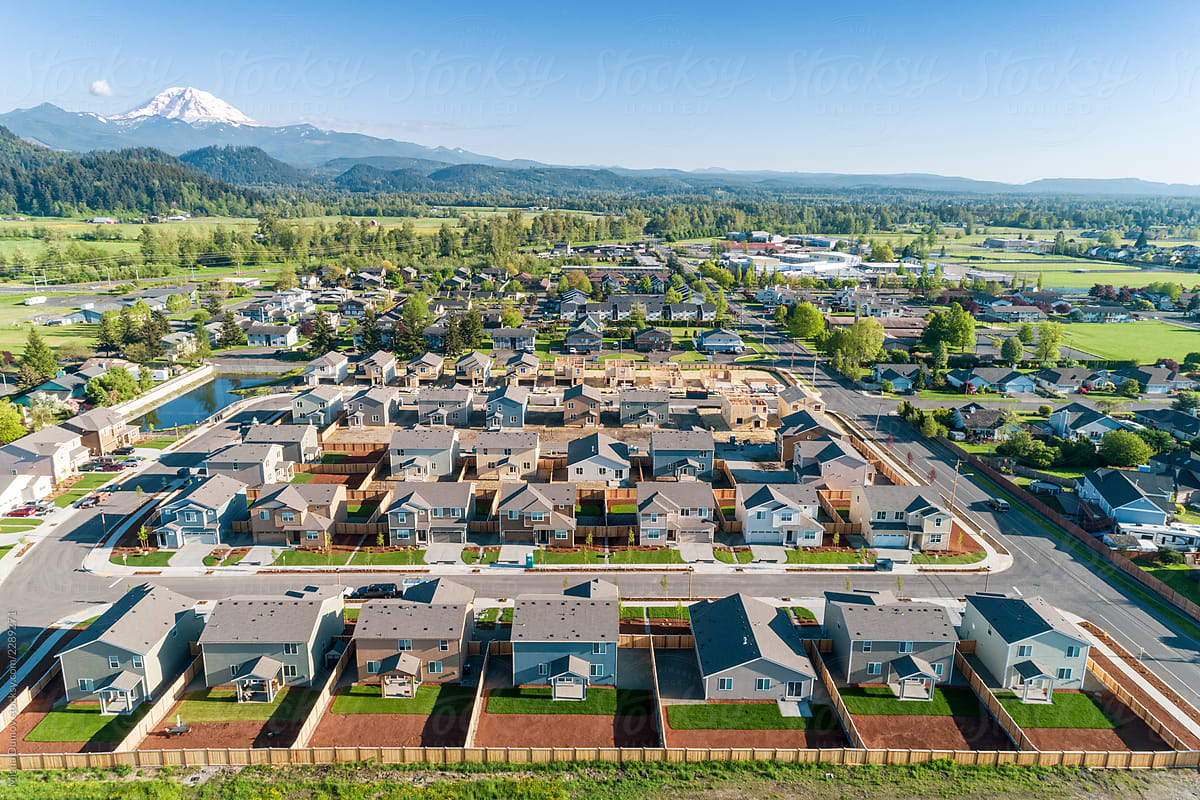 Drone view of a residential neighborhood with mountains