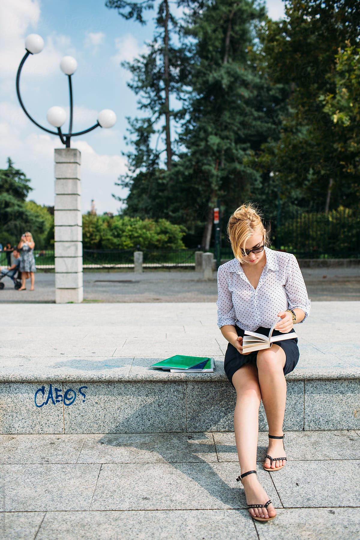 Blonde Woman Reading A Book By Stocksy Contributor Michela Ravasio