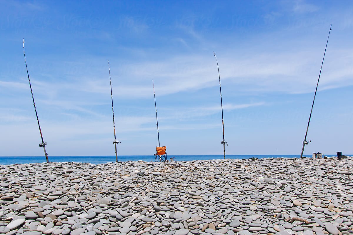 Many fishing rods on the beach