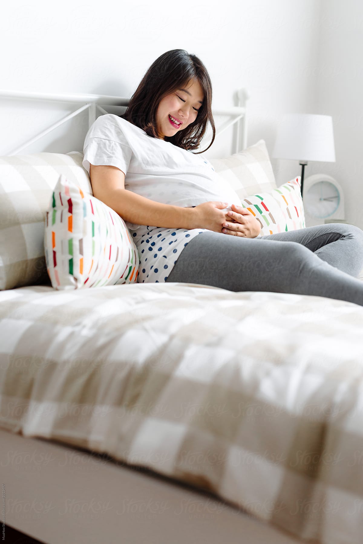 Pregnant Woman Having A Rest On Bed By Stocksy Contributor Maahoo Stocksy