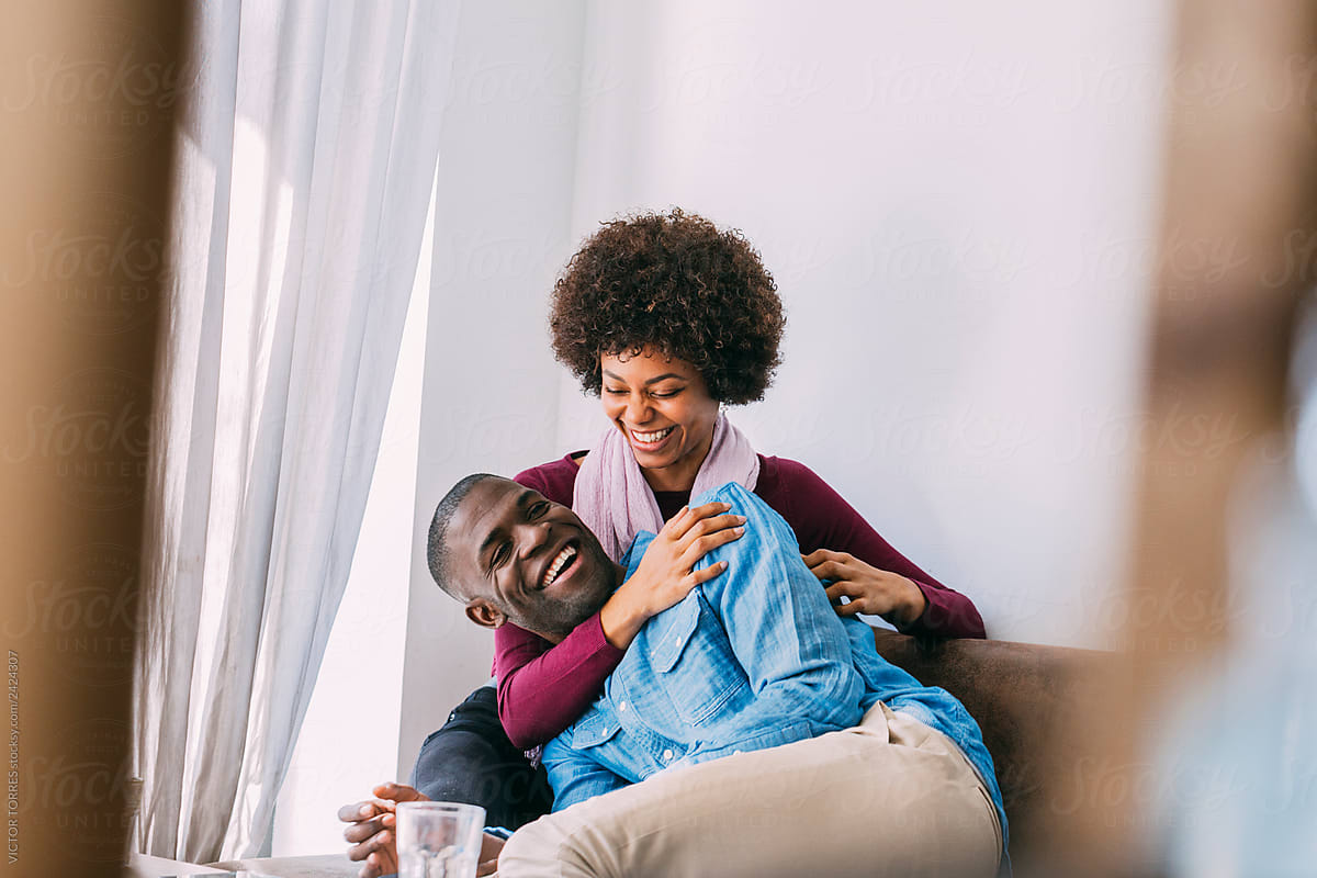 Black Couple Having A Good Time At Home By Stocksy Contributor Victor Torres Stocksy 