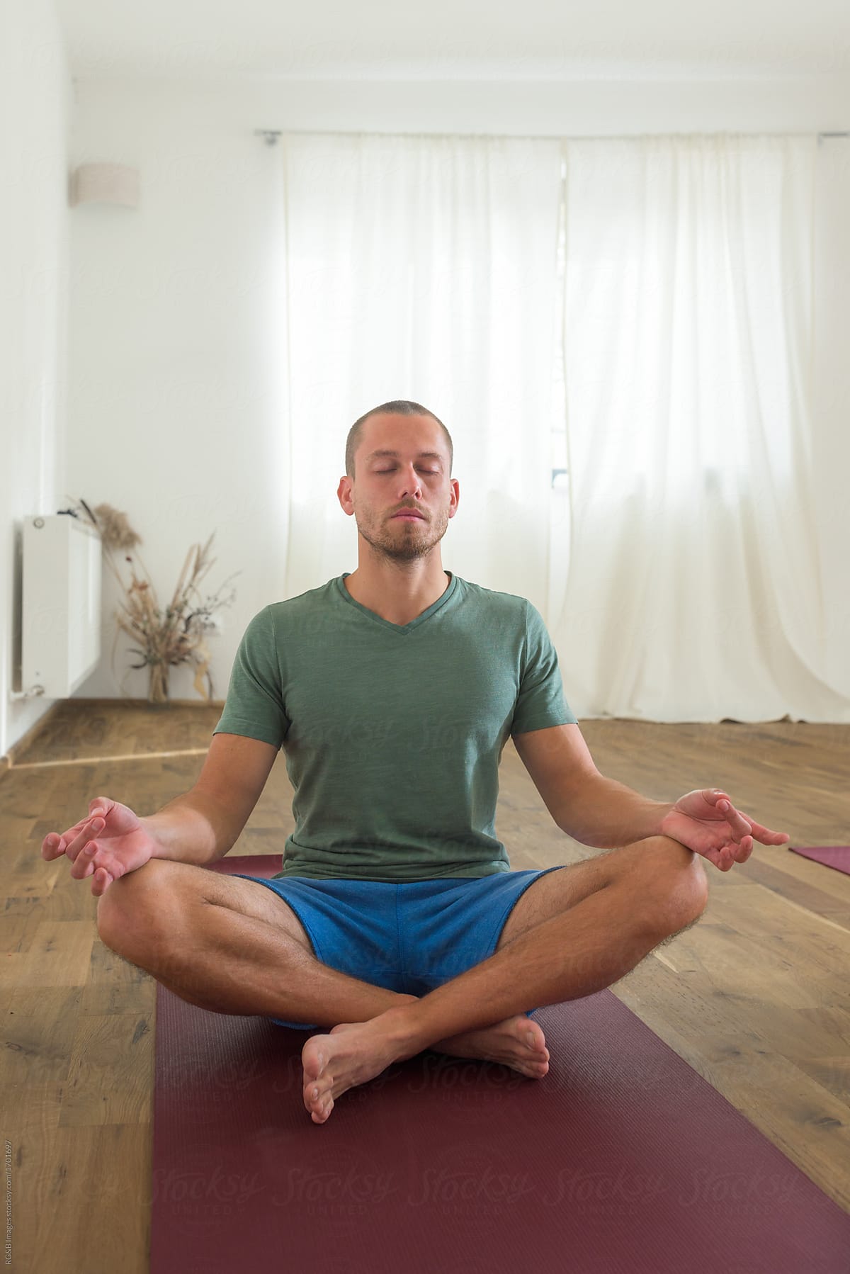 Man Meditating In The Lotus Pose by Stocksy Contributor Ibex.media -  Stocksy