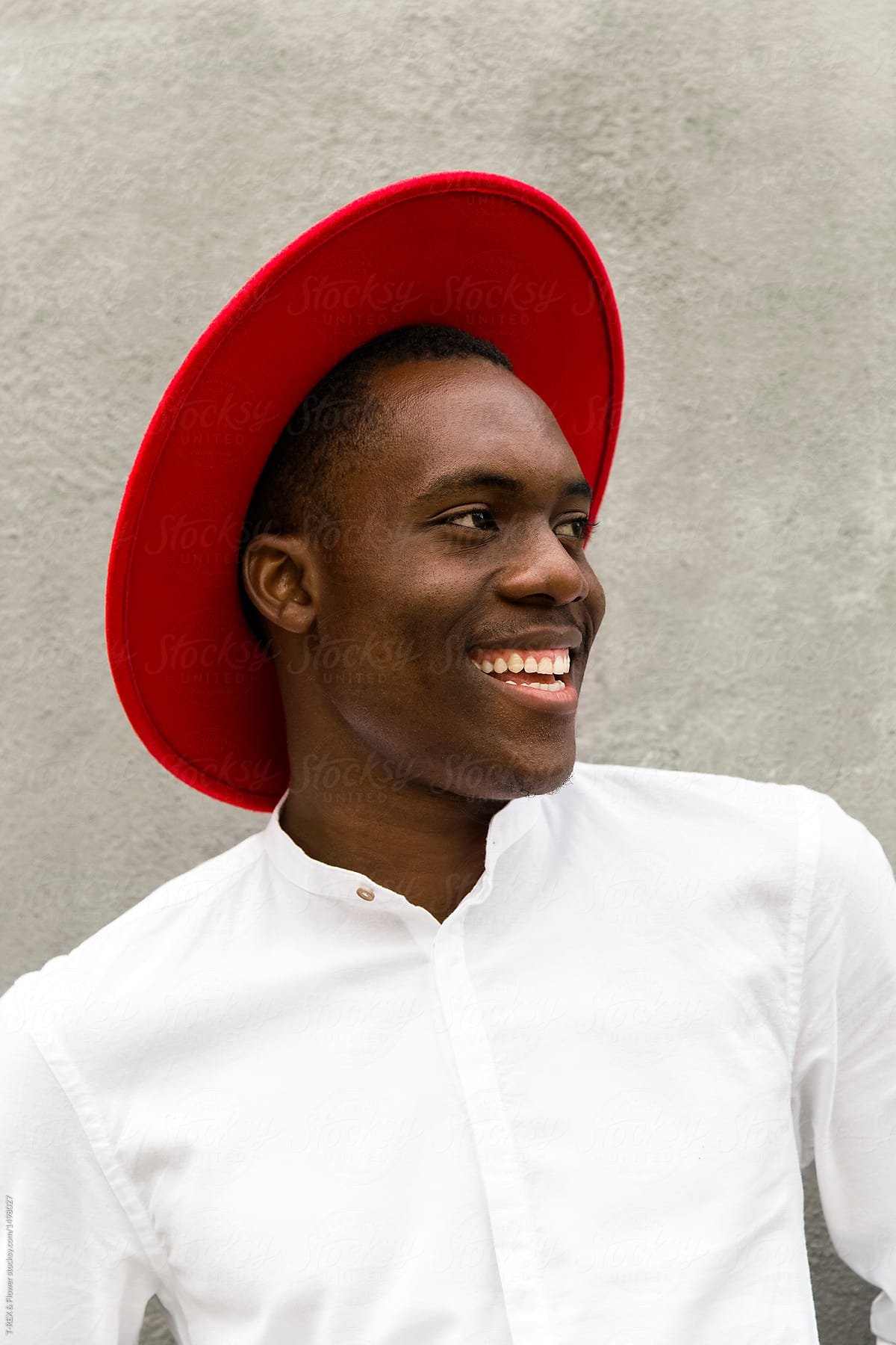 Cheerful man in red hat