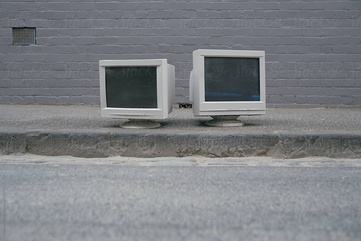 Old Computer and TV monitors thrown out on the street