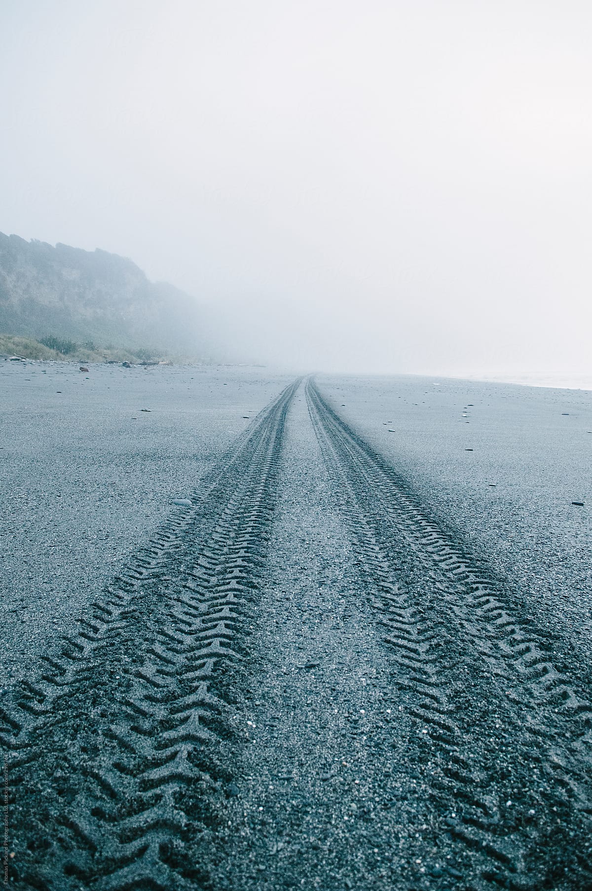 Vehicle tracks on a beach, West Coast, New Zealand.
