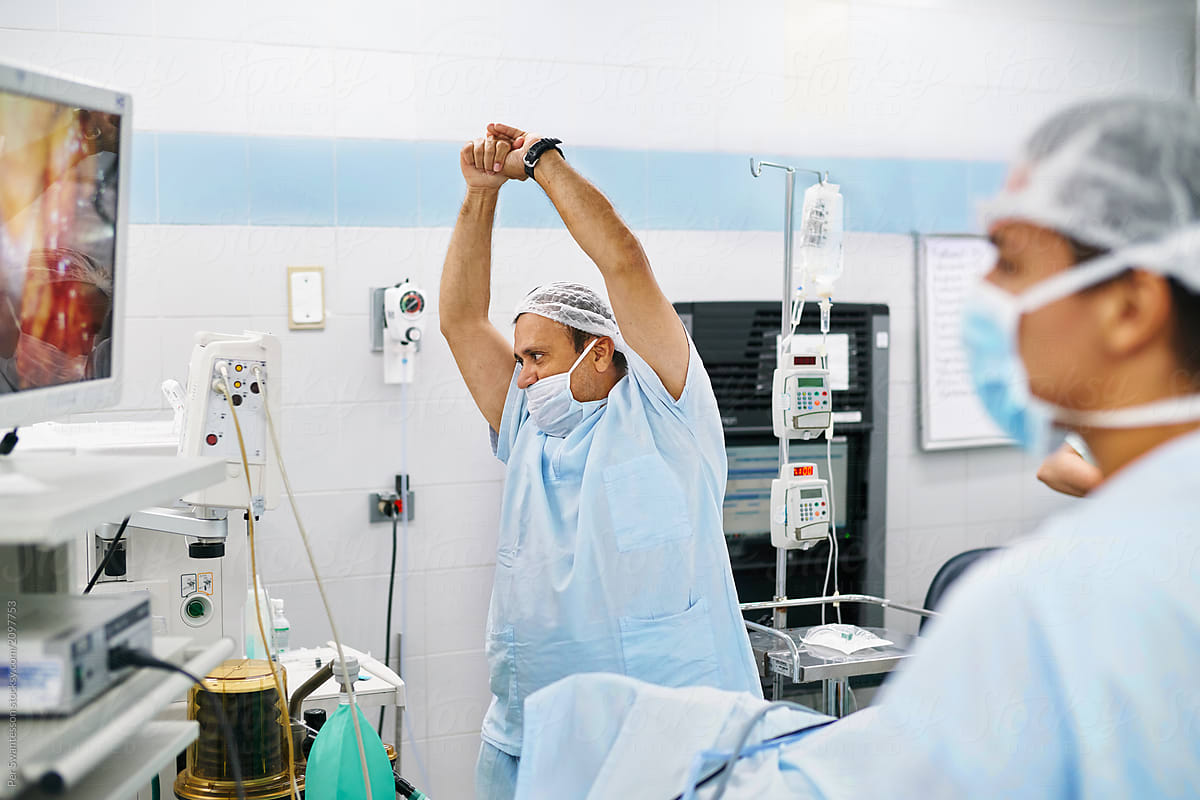 Surgeon stretching during an operation