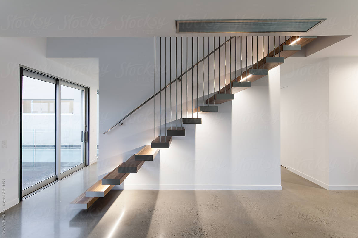 Architectural designed floating staircase in empty home