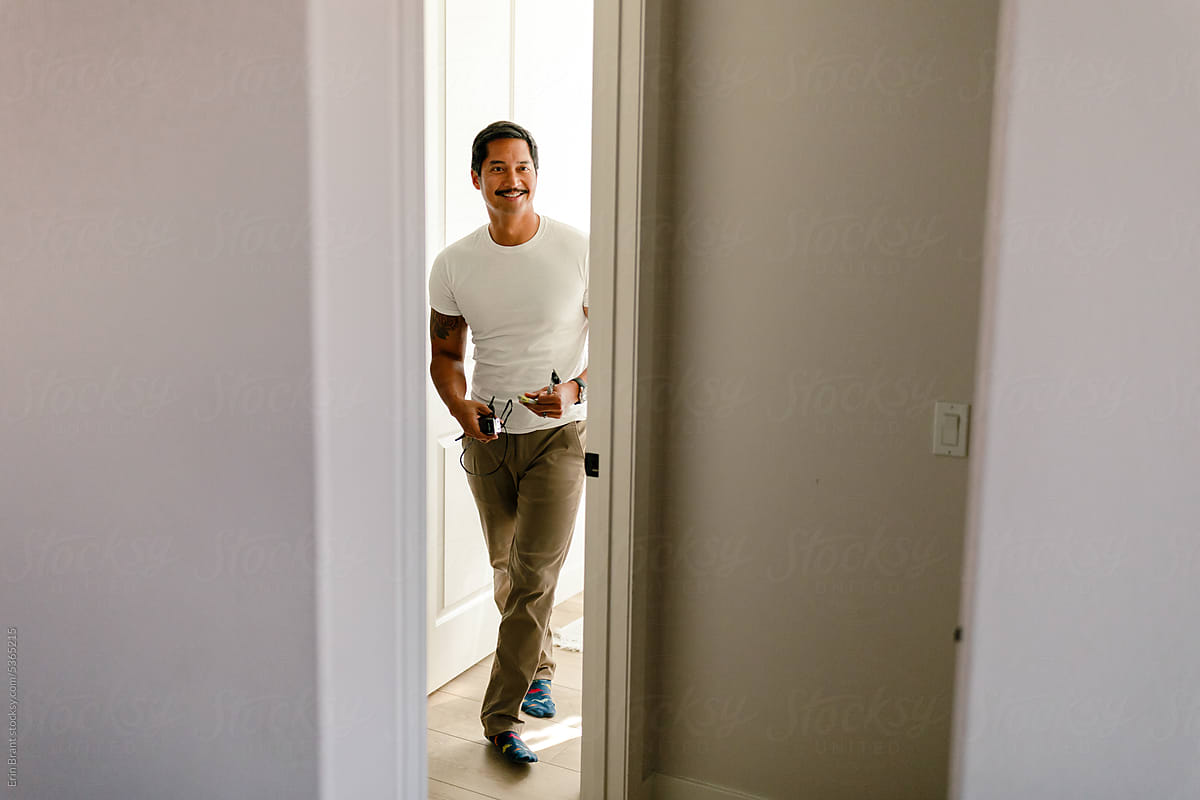 Smiling man in door frame