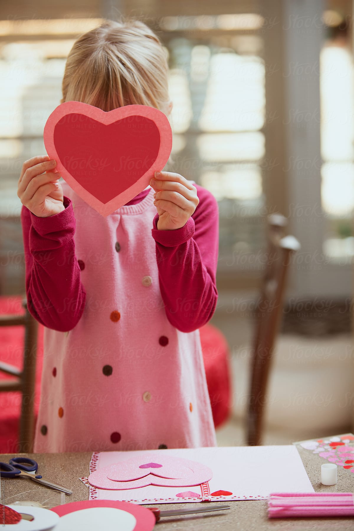 Valentine: Girl Hiding Behind Paper Heart