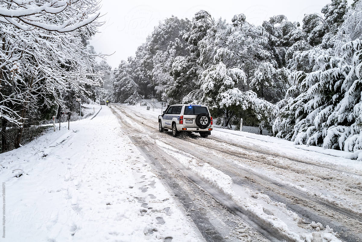 Police vehicles attend car accidents in treacherous snow conditions on Australian roads