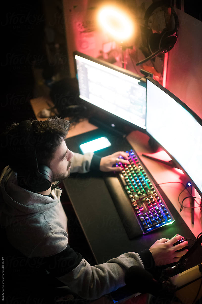 Focused pro gamer playing with his PC