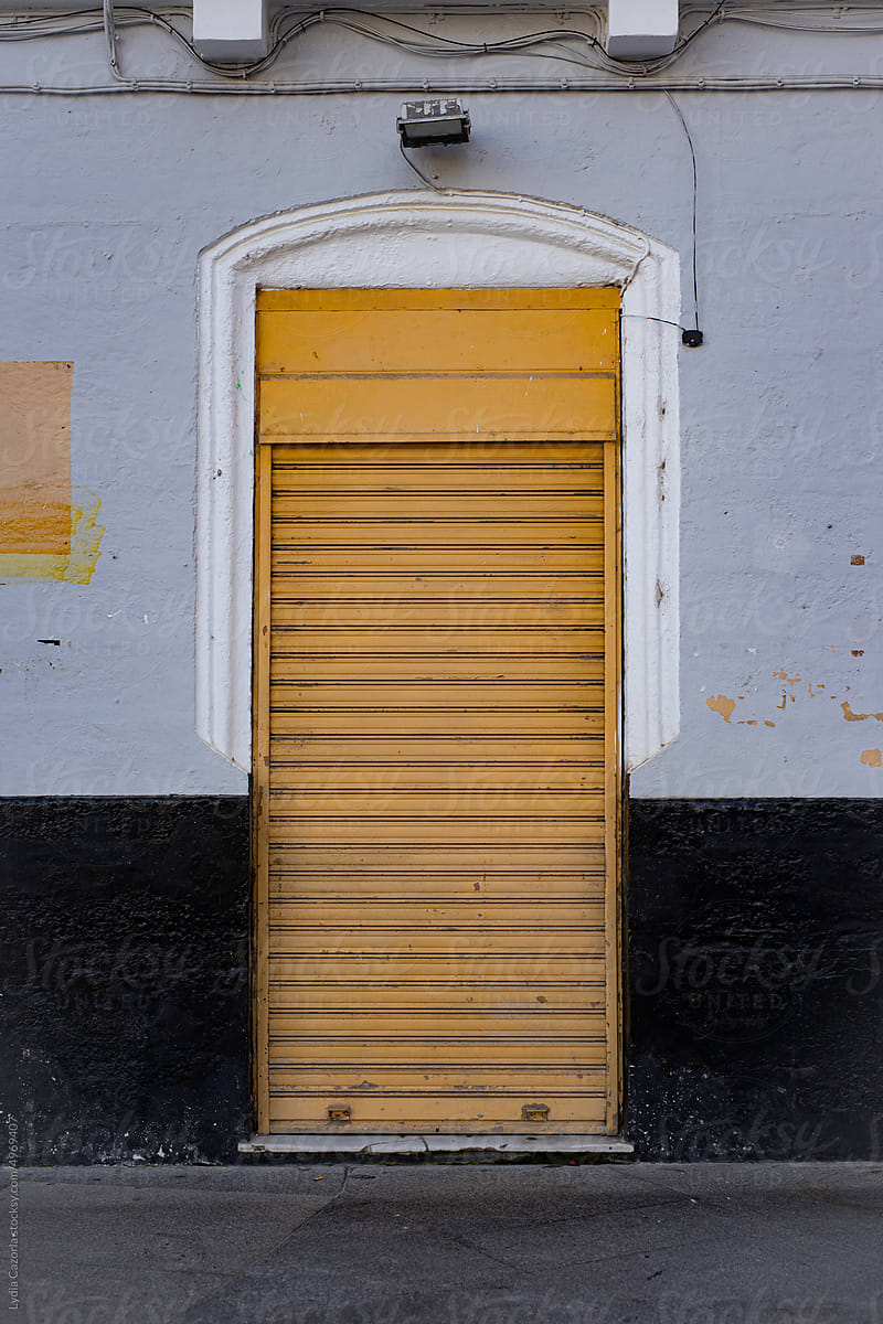 Typical facade of a  shop shutter  in Cadiz, Spain
