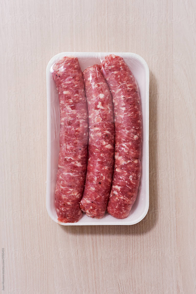 raw pork sausages packed in a foam tray