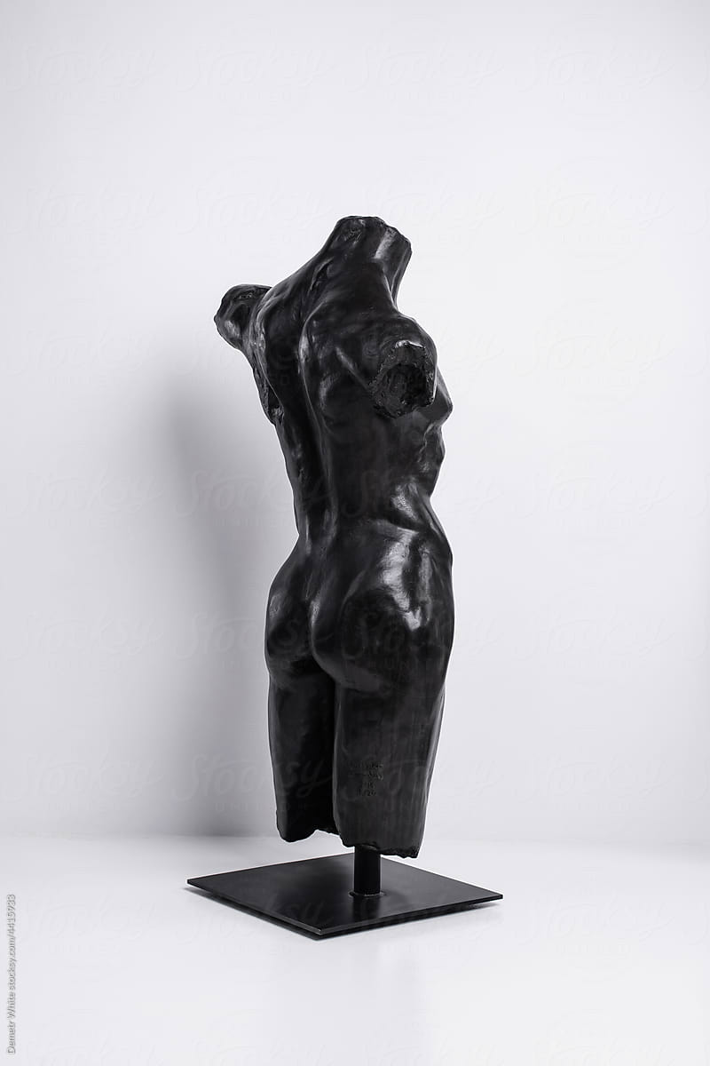 Black sculpture of torso