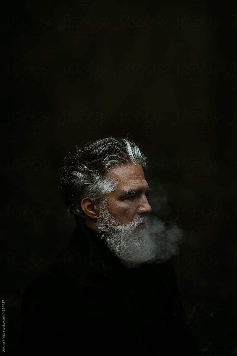 Portrait of older man smoking