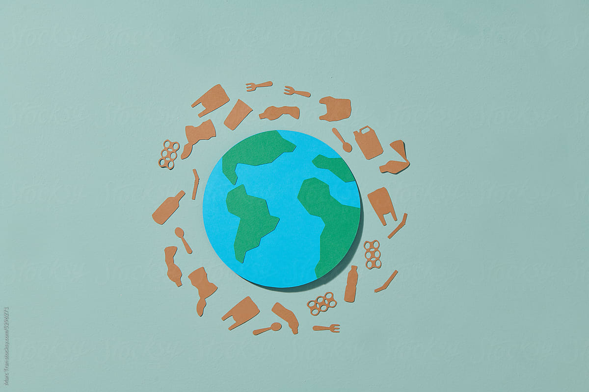 paper cut with earth isolated on color, environmental concept