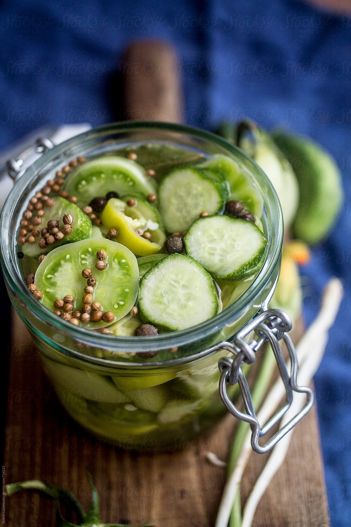 Spicy homemade pickles, peppers, green tomato pickles in the jar