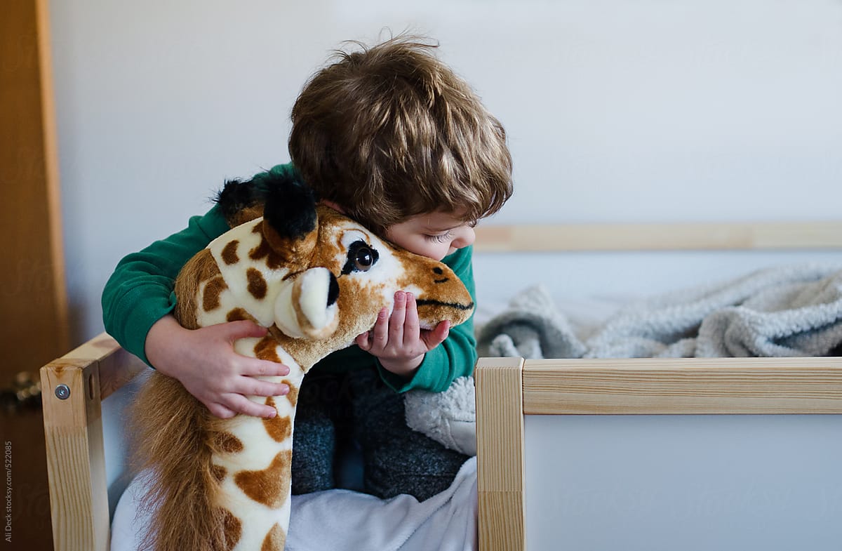Boy and Stuffed Giraffe