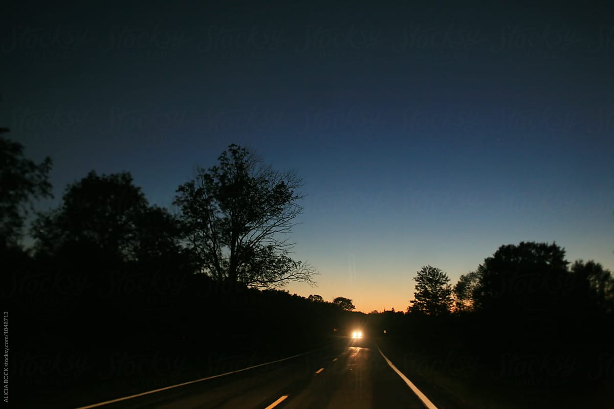 A Dark Road With One Car On A Summer Night