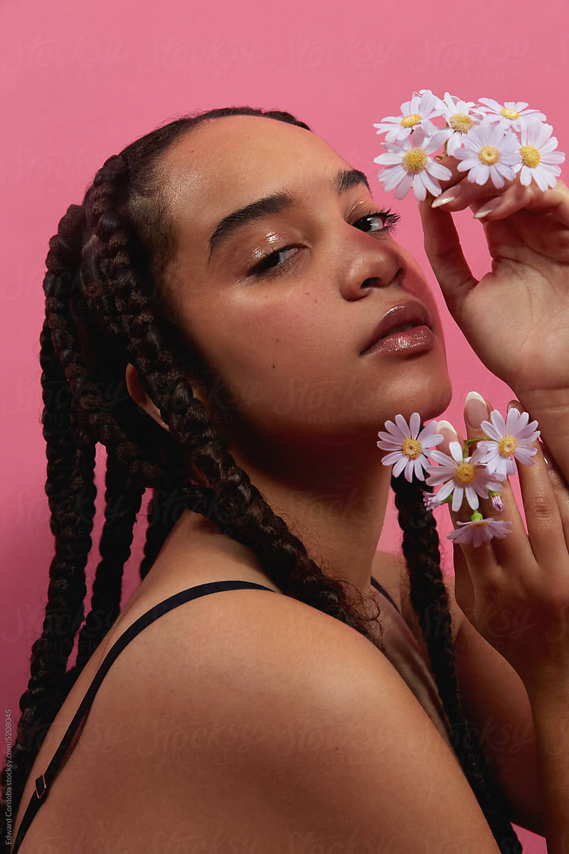 Brown girl with braids and flowers