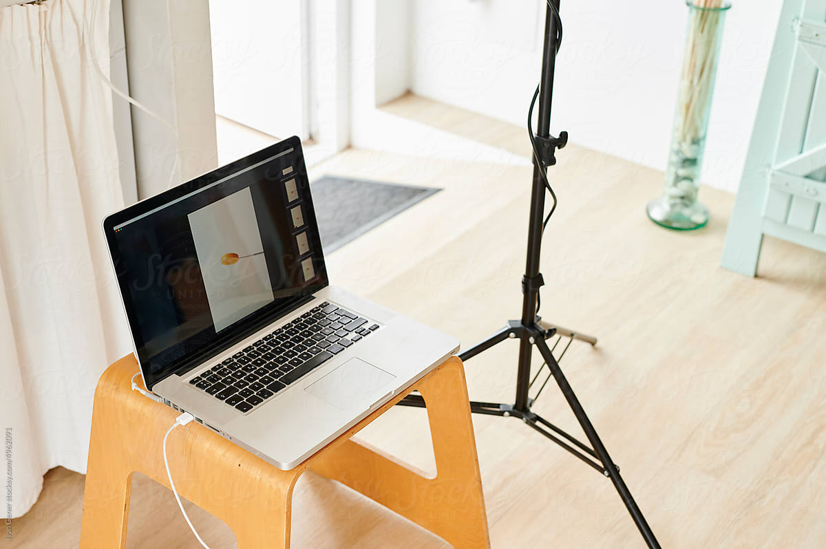 "Laptop and camera tethered for a shoot" by Stocksy Contributor "Ivan Gener"