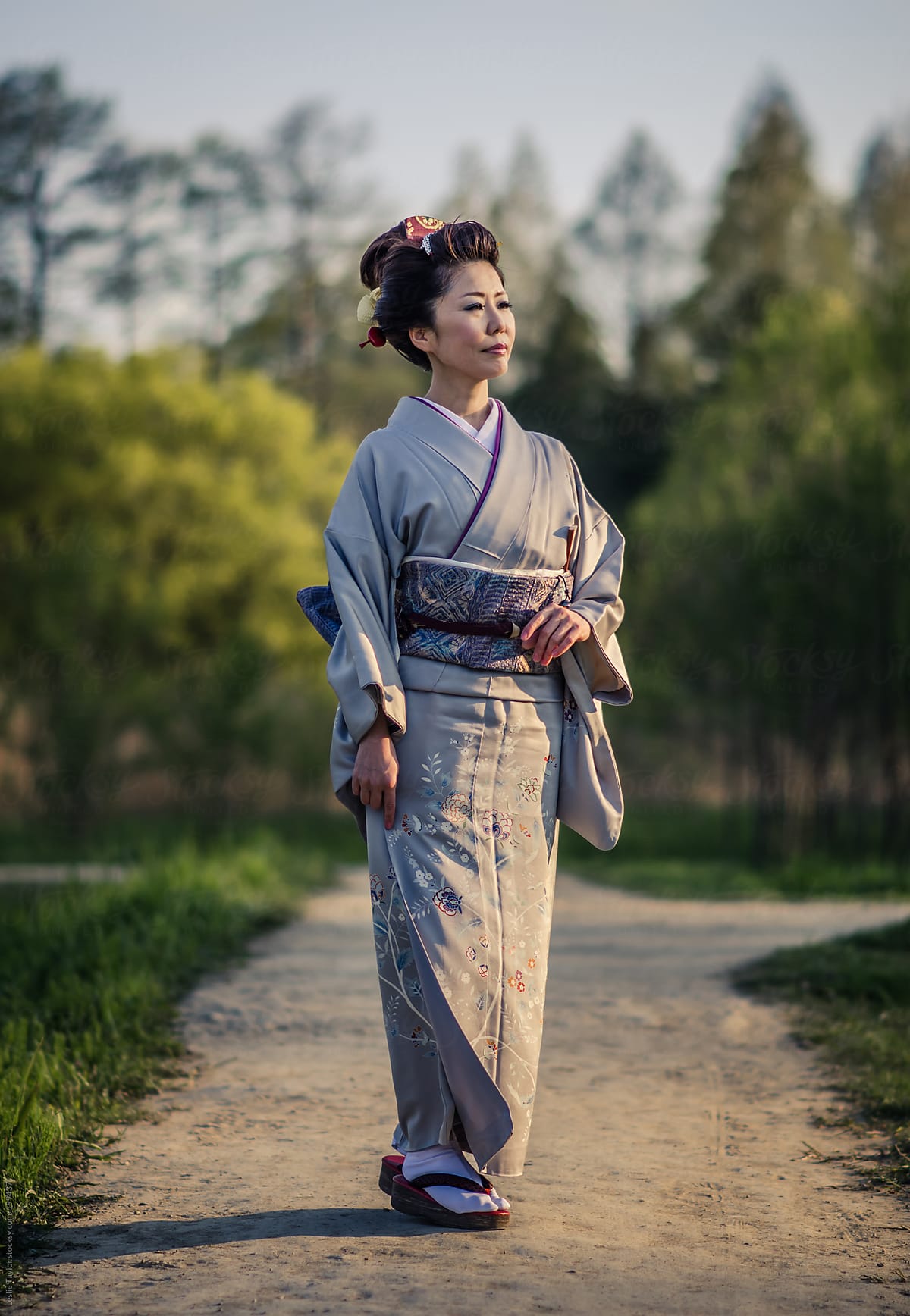 Woman In Kimono On Dirt Path