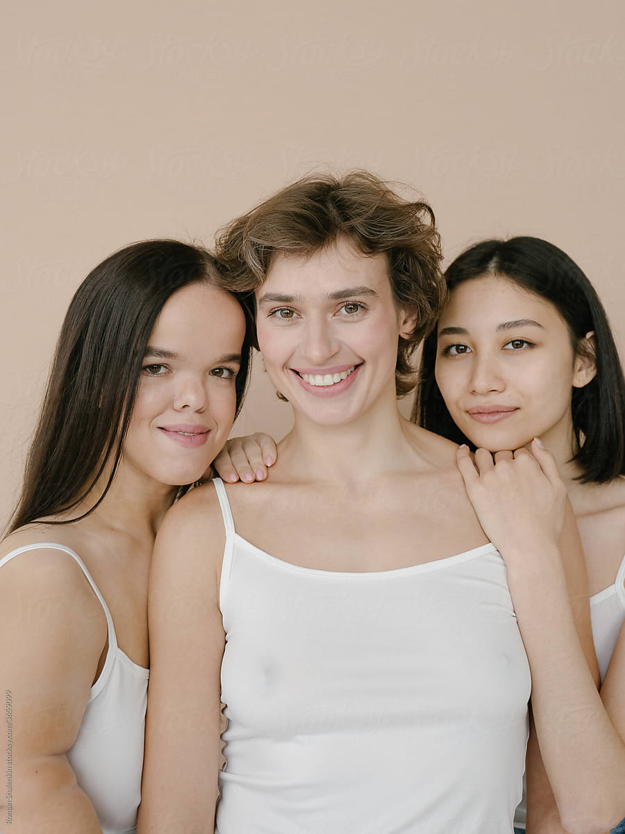 Diverse smiling young women in studio