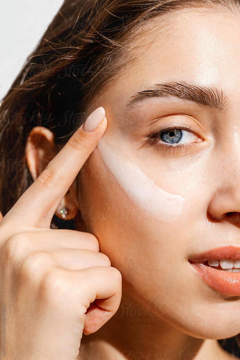 A Woman Applying Facial Cream Skincare Routine