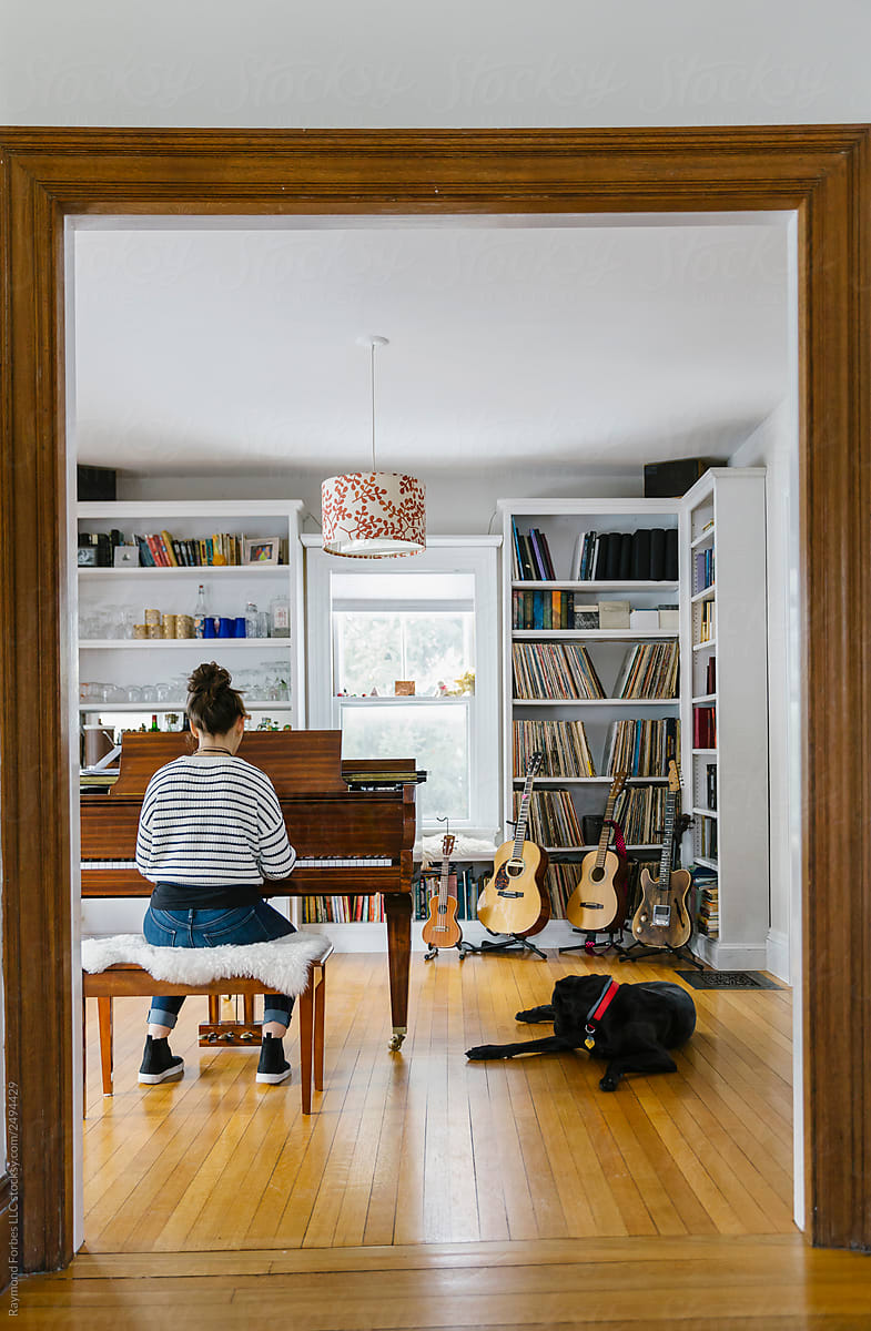 Teen Girl Playing Piano at Home