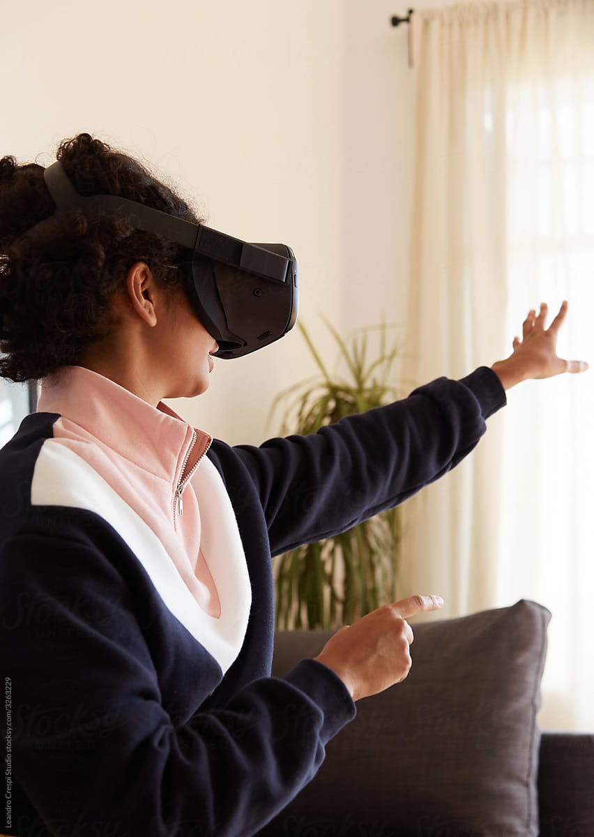 Woman reaching virtual object in VR
