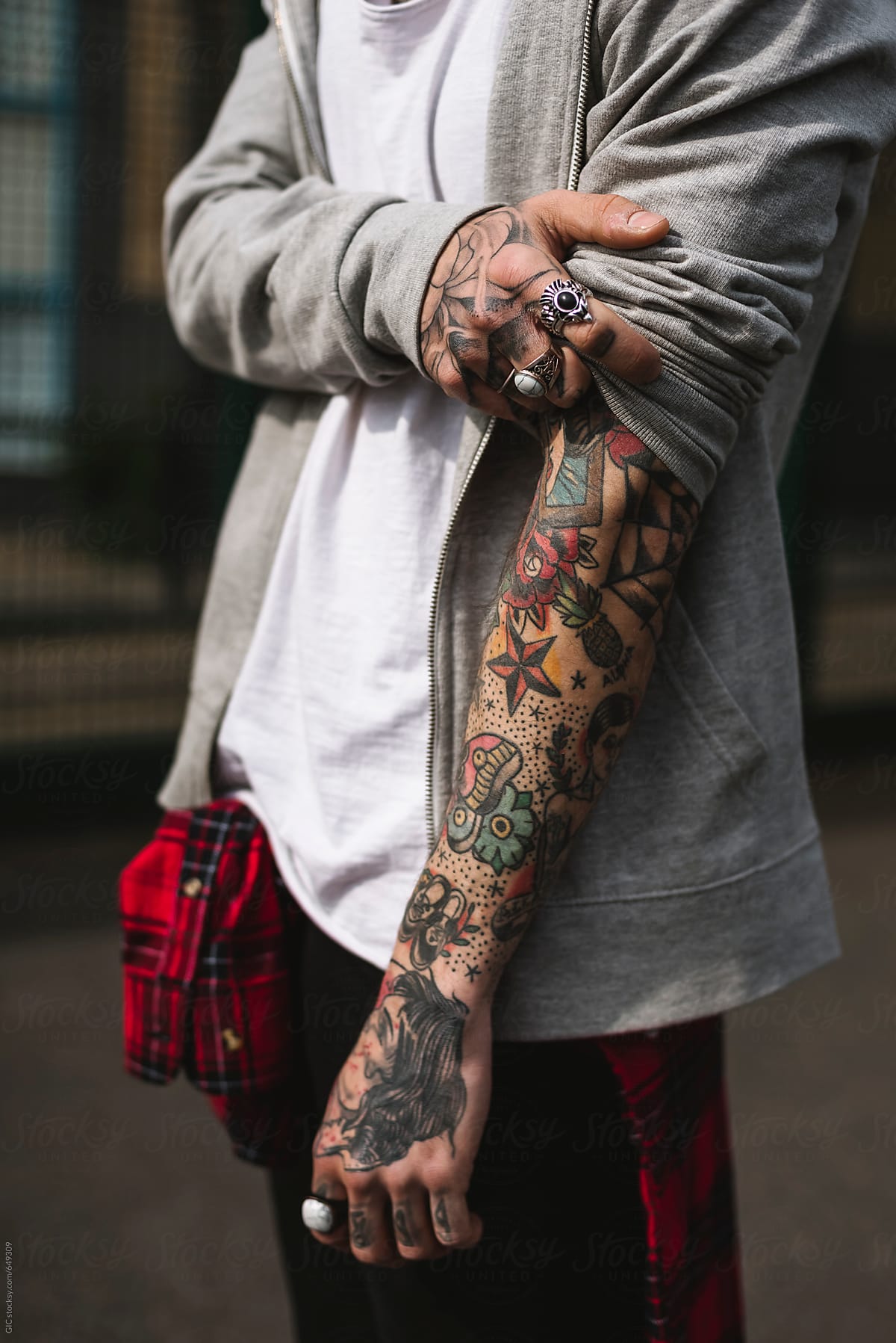 Man showing his tattooed arm