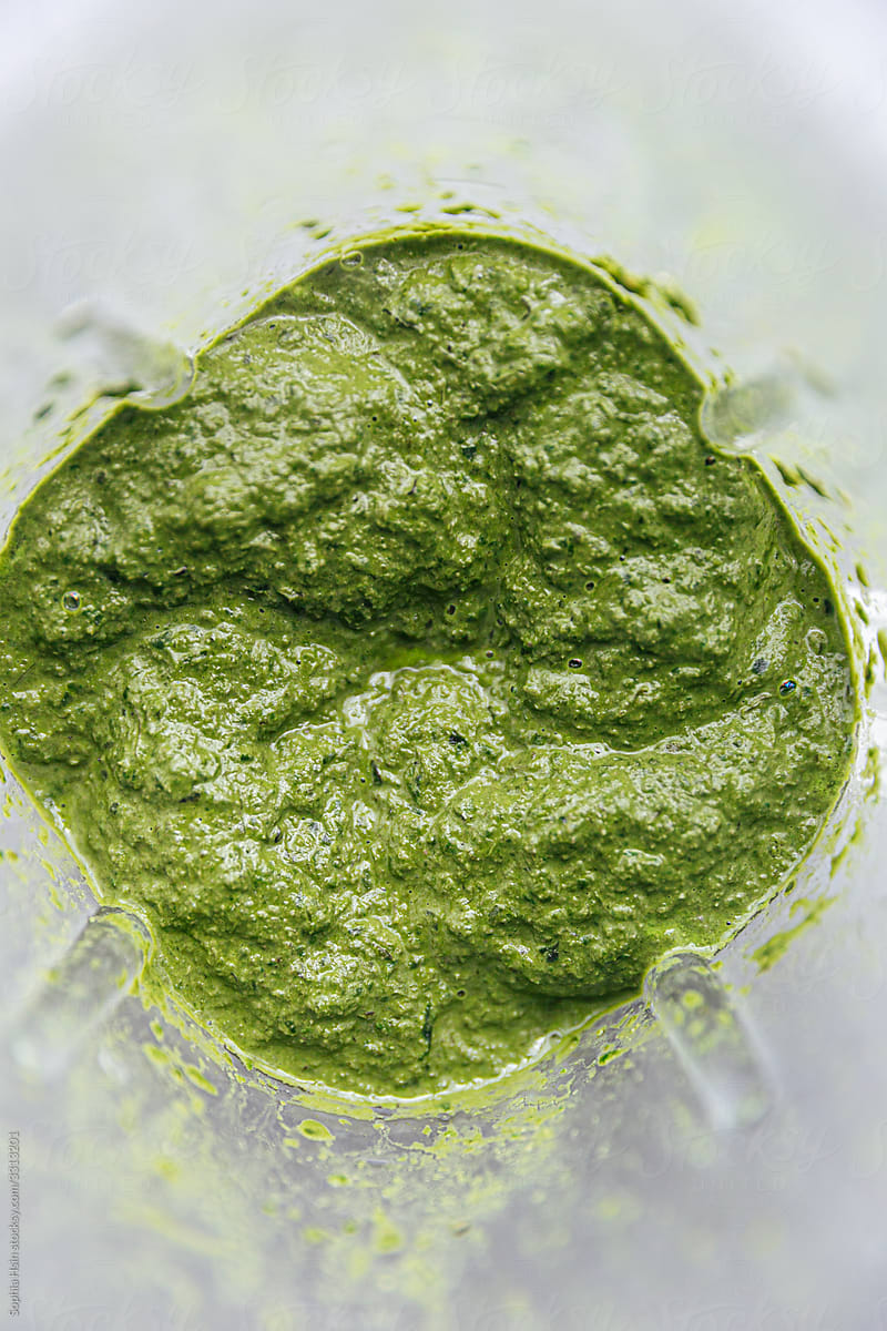 Greens pureeing in a blender