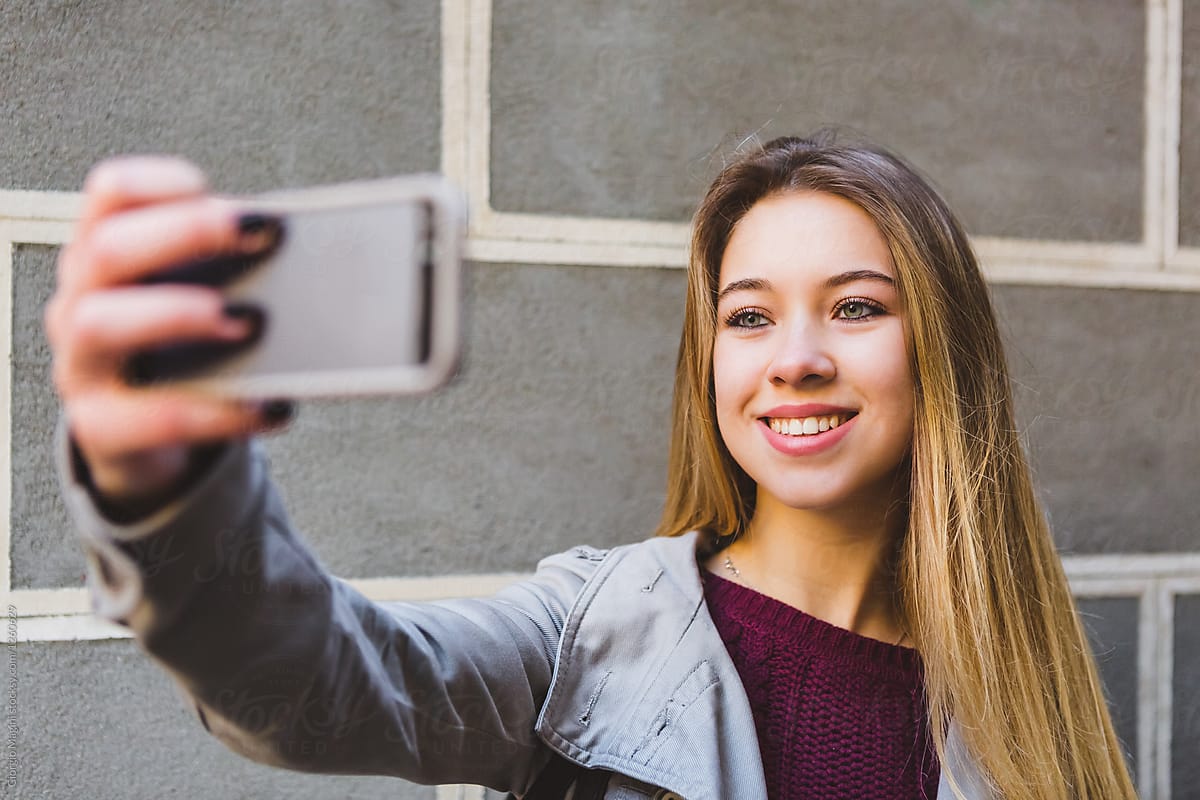Teenage Girl Taking a Selfie with Mobile Phone