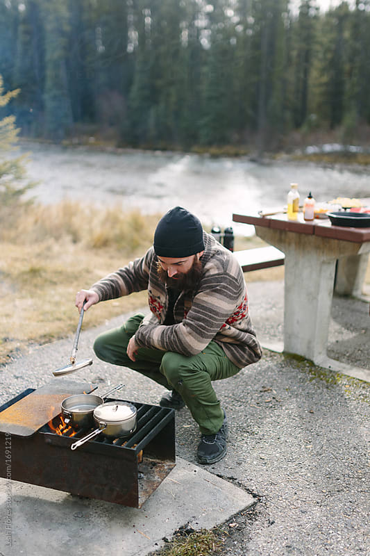 Man Cooking at Campsite